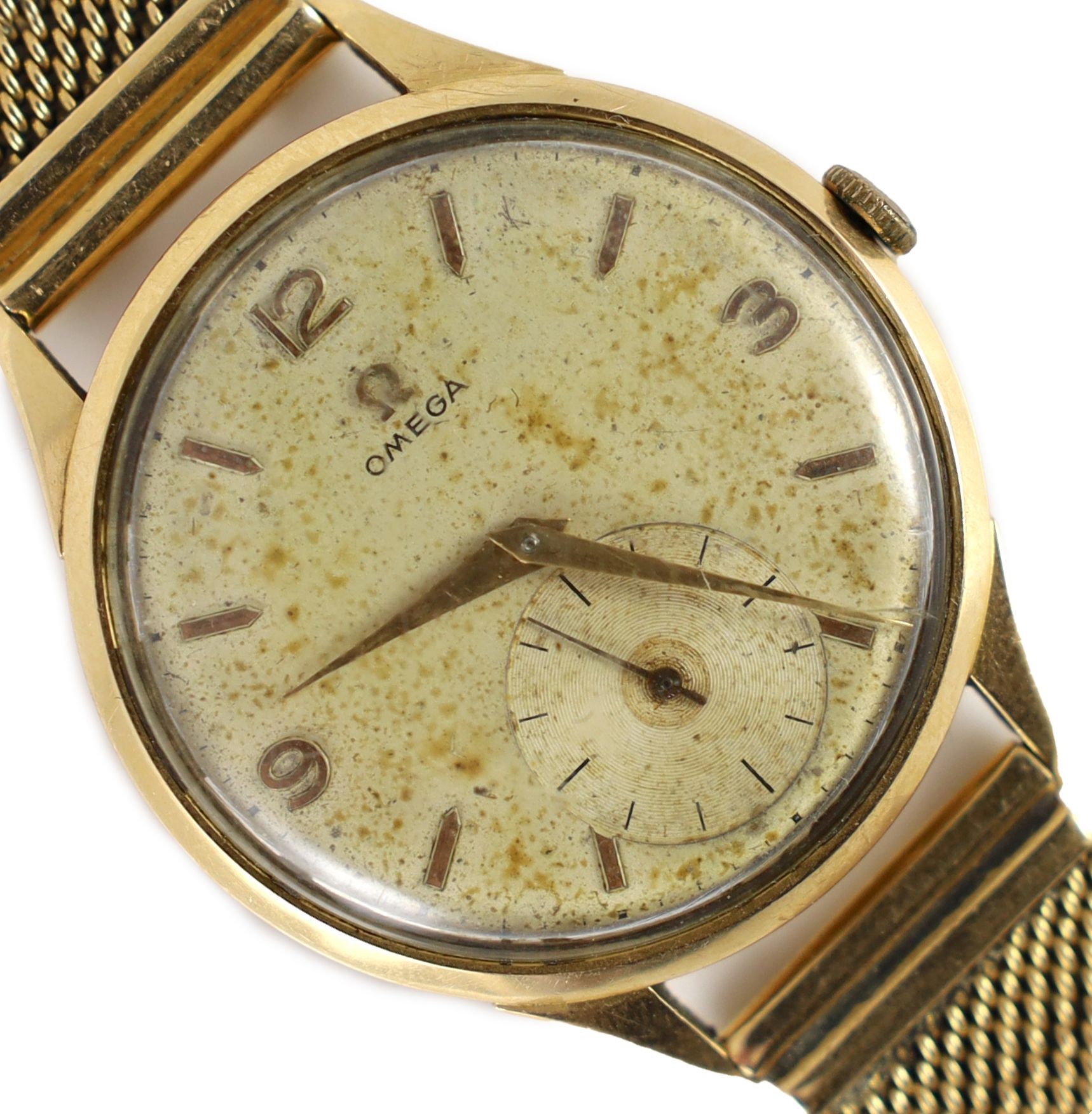 A gentleman's 1950's 18ct gold Omega manual wind wrist watch, on an Italian 750 yellow metal mesh link bracelet